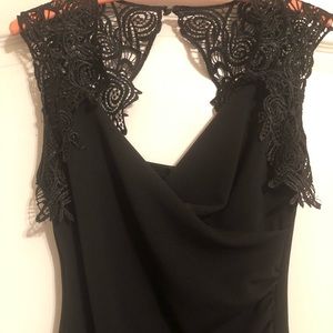 Little black dress with fancy lace. Surplice and rushing in the front